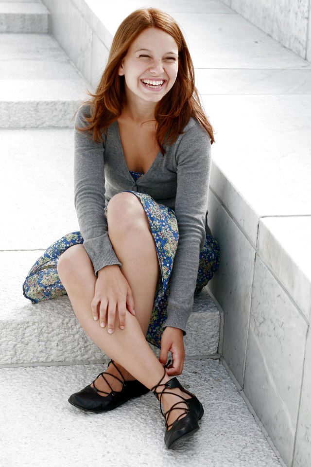 Woman smiling steps crossed legs free wallpaper for mobile - medium preview image