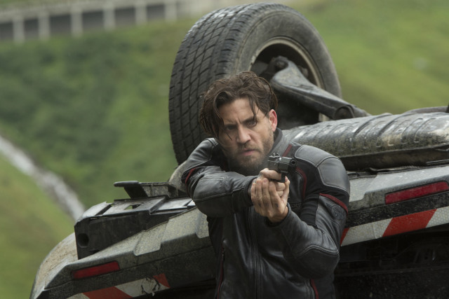 Man holding gun truck tire free wallpaper for desktop - medium preview image