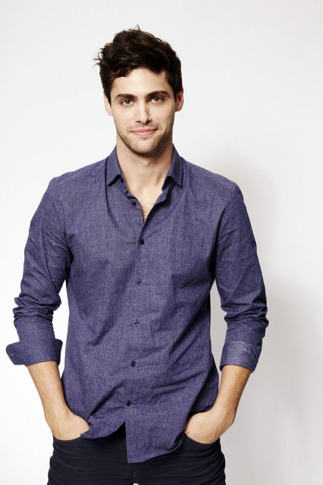 Man blue shirt posing picture free wallpaper for mobile - medium preview image