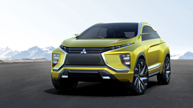 Yellow car driving road mountains free wallpaper for desktop - medium preview image