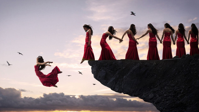 Woman red dress jumping cliff free wallpaper for desktop - medium preview image