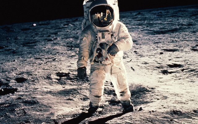 Astronaut walking moon helmet glove free wallpaper for desktop - medium preview image