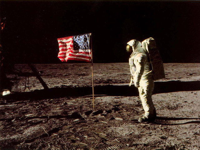 Astronaut standing on moon next free wallpaper for desktop - medium preview image