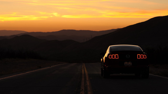 Car driving road mountains sunset free wallpaper for desktop - medium preview image