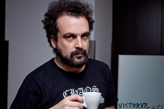 Man holding coffee serious look free wallpaper for desktop - medium preview image