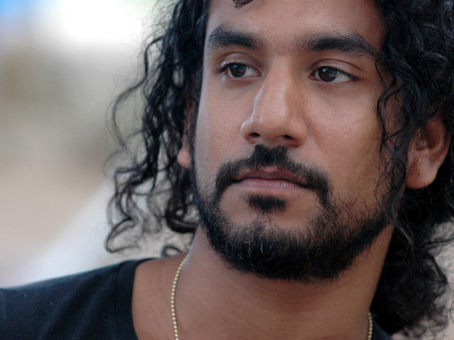 Bearded man serious necklace looking free wallpaper for desktop - medium preview image