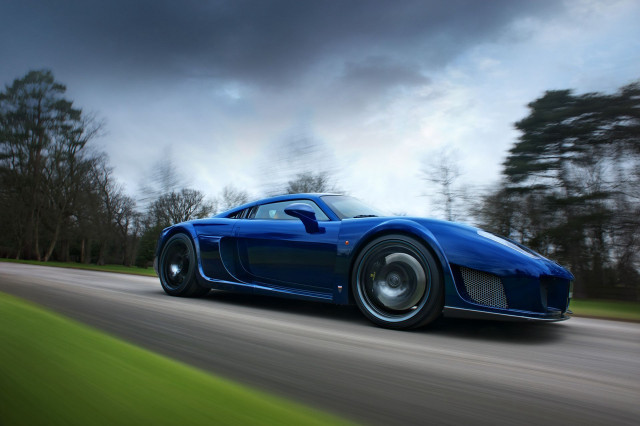 Blue sports car driving cloudy #3 free wallpaper for desktop - medium preview image
