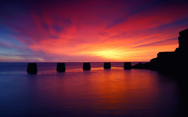 Sunset pillars water clouds sky free wallpaper for desktop - medium preview image