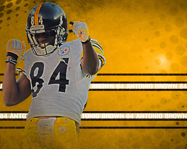 Football player holding ball yellow free wallpaper for desktop - medium preview image