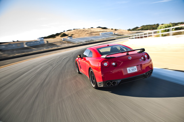 Red sports car road hill #2 free wallpaper for desktop - medium preview image
