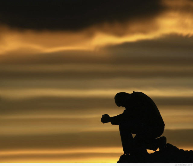 Silhouette man sitting rock cross free wallpaper for desktop - medium preview image