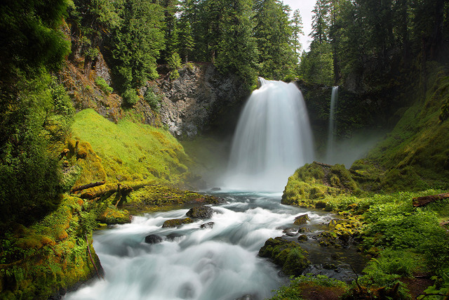 Waterfall cascading forest green grass free wallpaper for desktop - medium preview image