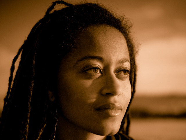 Woman dreadlocks serious look camera free wallpaper for desktop - medium preview image