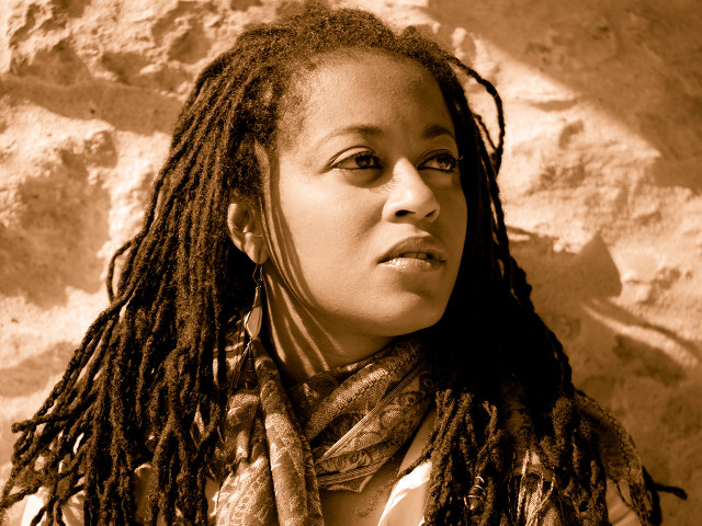 Woman dreadlocks rock wall scarf free wallpaper for desktop - medium preview image