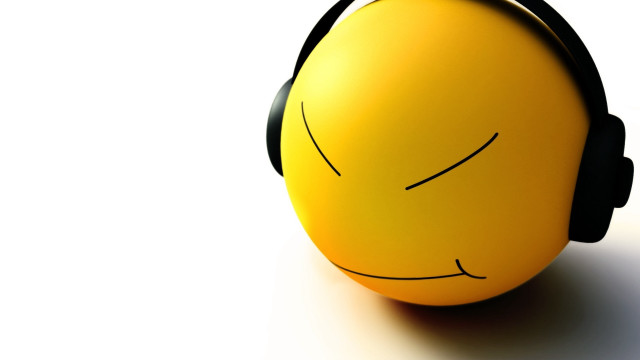Yellow ball headphone smiley face free wallpaper for desktop - medium preview image