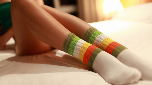 Colorful socks woman bed crossed free wallpaper for desktop - medium preview image