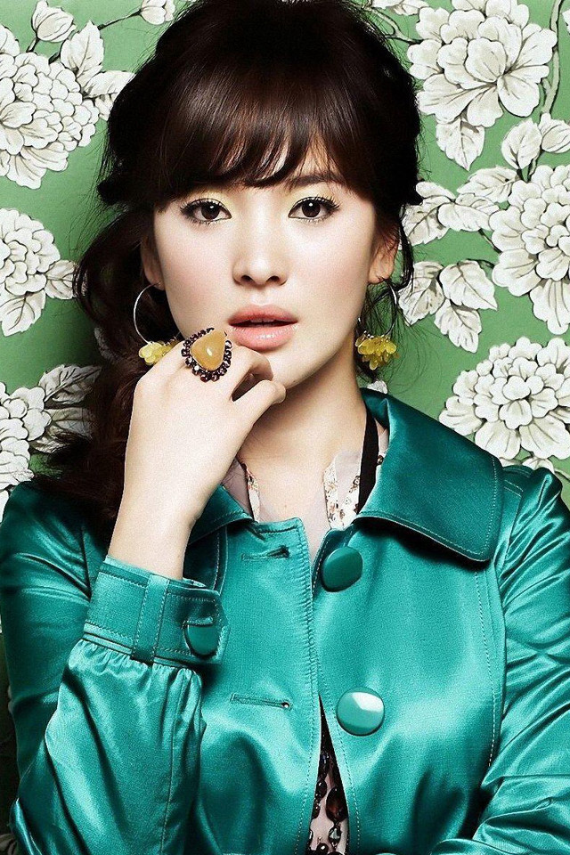 Woman green jacket posing hand free wallpaper for mobile - medium preview image