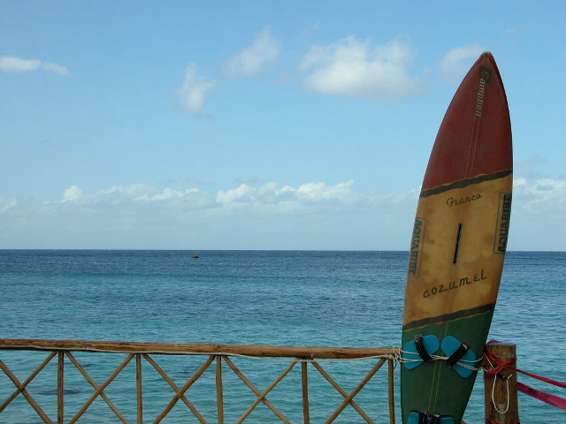 Surfboard fence ocean boat distance free wallpaper for desktop - medium preview image