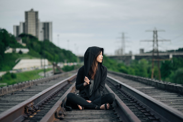 Woman sitting train track hood free wallpaper for desktop - medium preview image