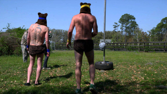 Couple people grass frisbee bear free wallpaper for desktop - medium preview image