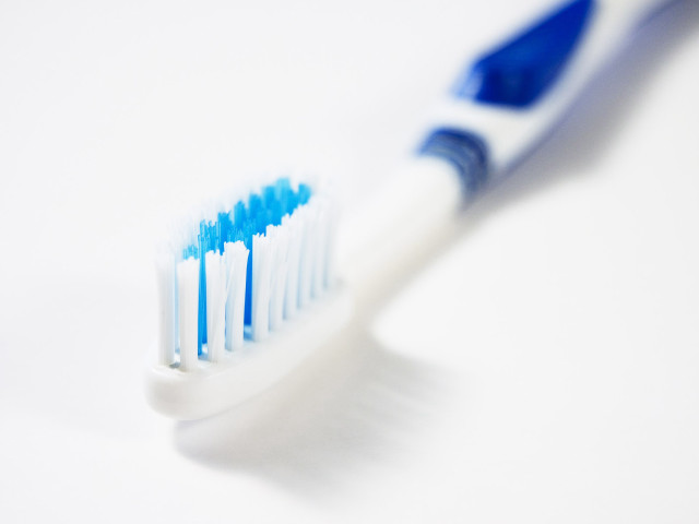 Toothbrush blue white bristles closeup free wallpaper for desktop - medium preview image