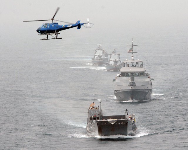 Helicopter flying fleet ships ocean free wallpaper for desktop - medium preview image