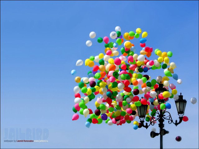 Balloons floating above street light free wallpaper for desktop - medium preview image