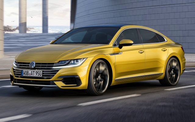 Yellow volkswagen arteus driving street free wallpaper for desktop - medium preview image