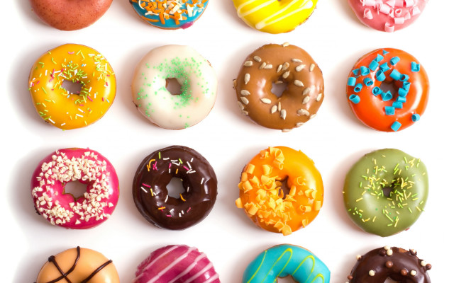 Dozen donuts arranged row white free wallpaper for desktop - medium preview image