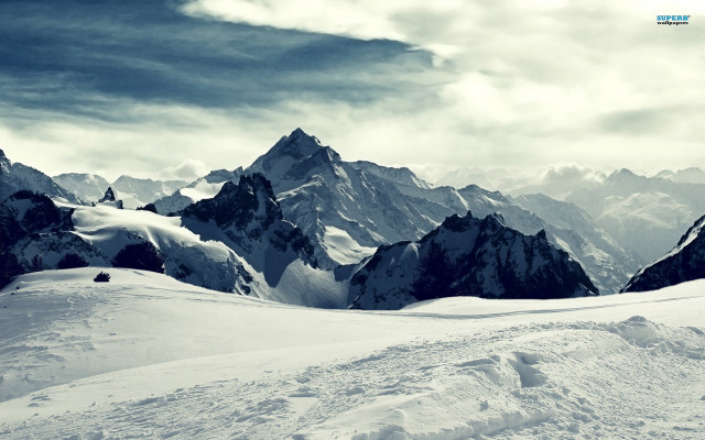 Person skiing snowy mountain slope free wallpaper for desktop - medium preview image