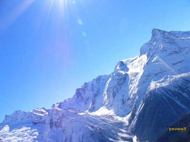 Snowboarder snowy mountain sunshine skiing free wallpaper for desktop - medium preview image