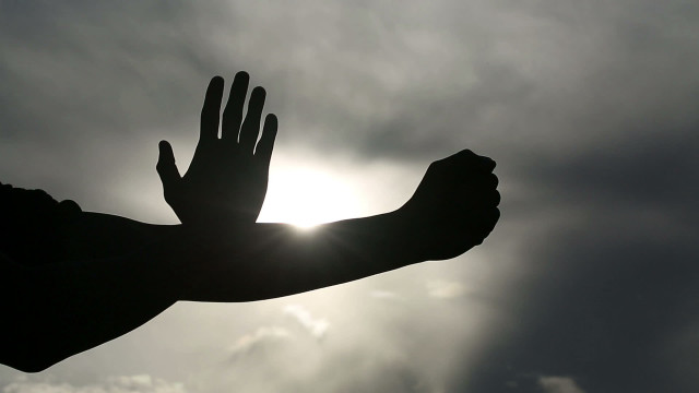Outstretched hand sun clouds dark free wallpaper for desktop - medium preview image