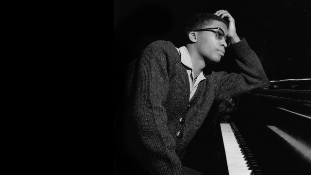 Man leaning piano hands on free wallpaper for desktop - medium preview image