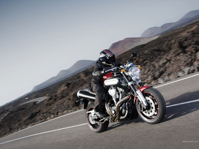 Man motorcycle road mountain range free wallpaper for desktop - medium preview image