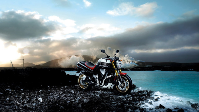 Motorcycle rocky shore ocean mountain free wallpaper for desktop - medium preview image