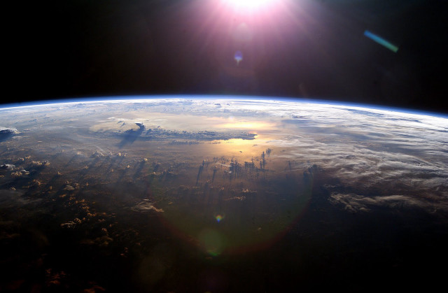 Sun shining earth space view #2 free wallpaper for desktop - medium preview image
