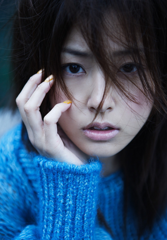 Woman blue sweater phone serious free wallpaper for mobile - medium preview image