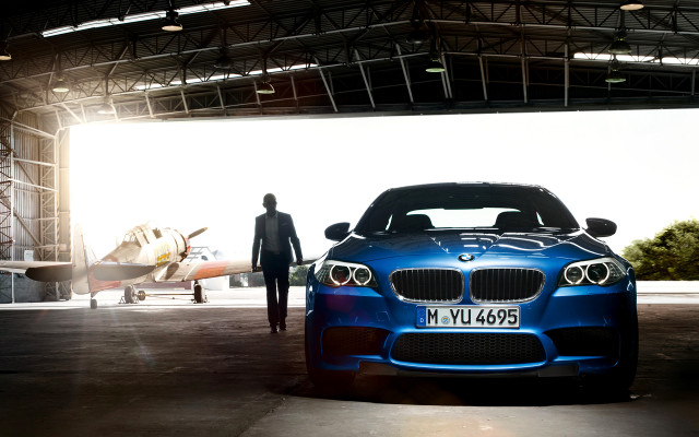 Man blue car hangar plane free wallpaper for desktop - medium preview image