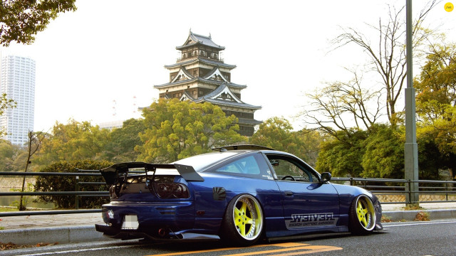 Blue car yellow wheels pagoda free wallpaper for desktop - medium preview image