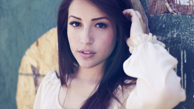 Woman long hair leaning wall #2 free wallpaper for desktop - medium preview image