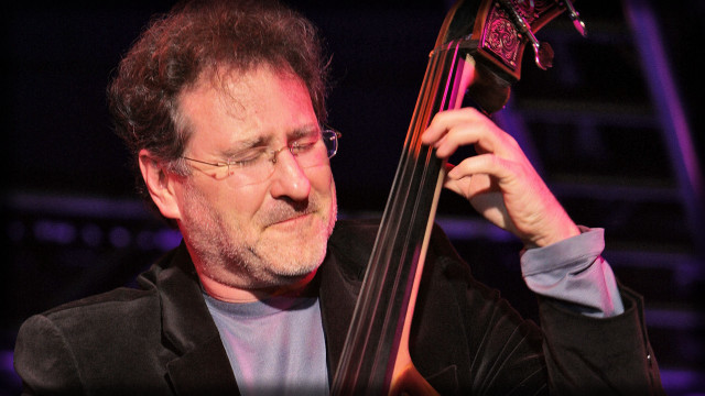 Man holding bass serious look free wallpaper for desktop - medium preview image