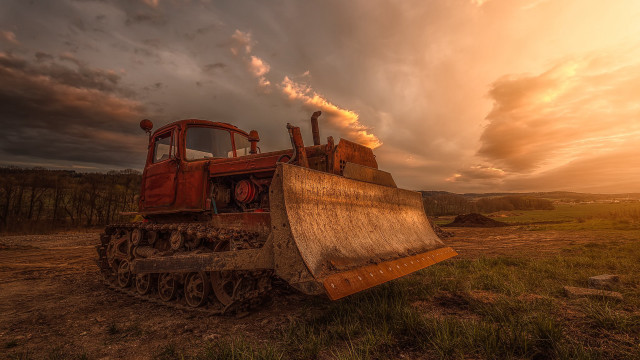Tractor parked field cloudy sky free wallpaper for desktop - medium preview image