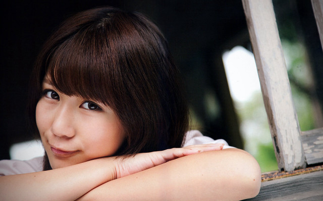 Woman arms crossed smiling looking free wallpaper for desktop - medium preview image