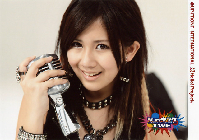 Woman holding cell phone smiling #2 free wallpaper for desktop - medium preview image