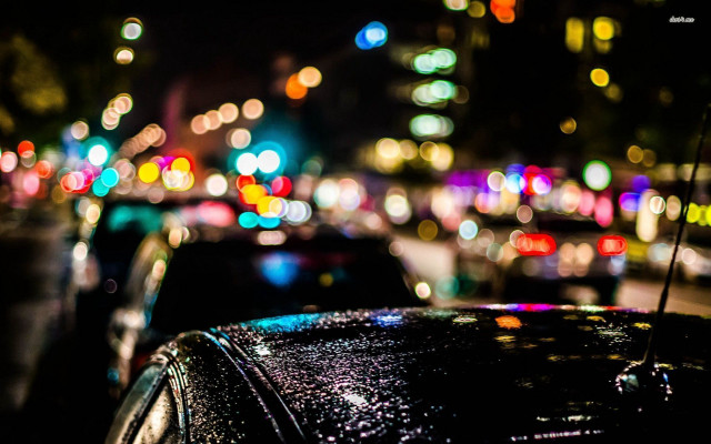 Car parked busy street night free wallpaper for desktop - medium preview image