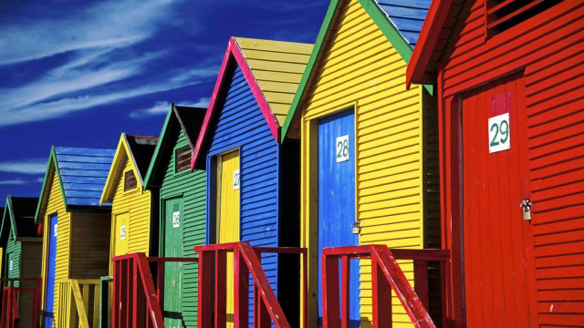 Colorful beach huts blue sky free wallpaper for desktop - medium preview image