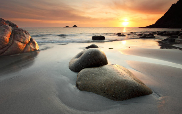 Rocks sand water sunset background free wallpaper for desktop - medium preview image