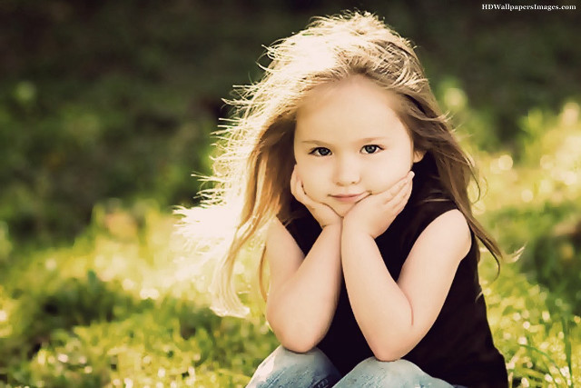 Little girl grass hands chin free wallpaper for desktop - medium preview image