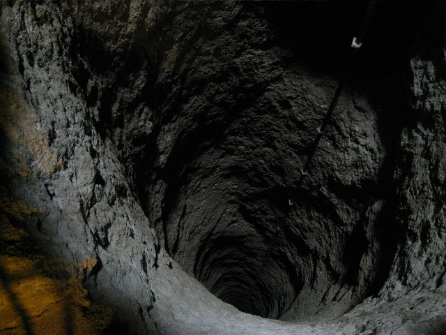 Man tunnel cellphone flashlight standing free wallpaper for desktop - medium preview image