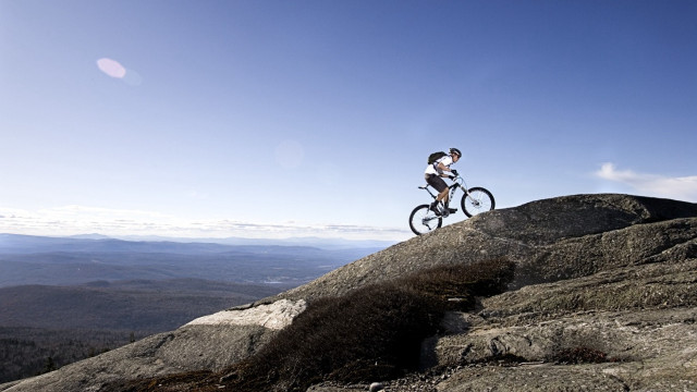 Man riding bike rocky mountain #2 free wallpaper for desktop - medium preview image